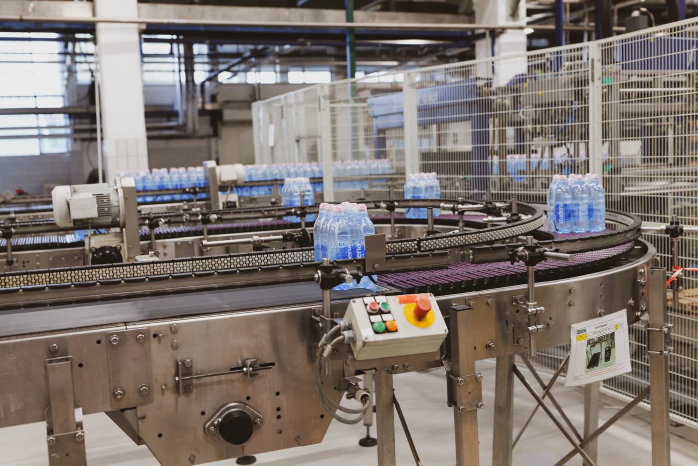 Bottles moving on a conveyor in a bottling plant