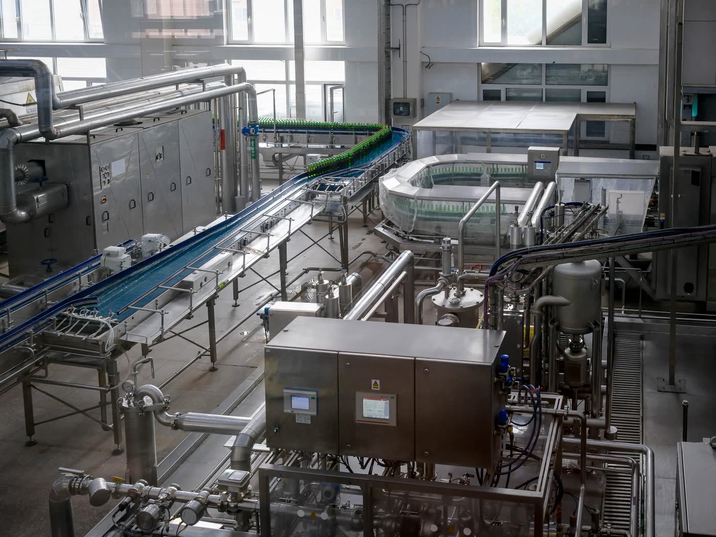 Inside an automated bottling plant with conveyors